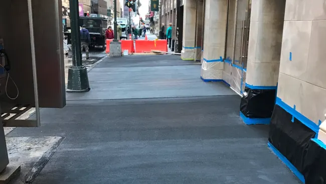 Sidewalk shed over the pavement beside a New York City building